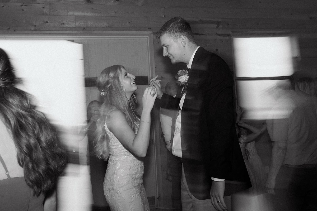 An artistic black-and-white portrait of a couple.