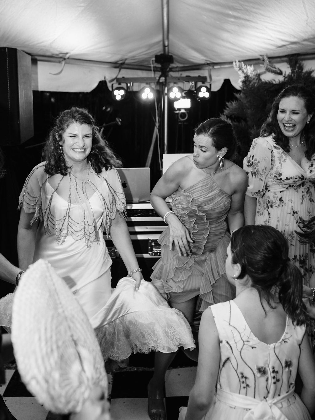 Black and white photograph of wedding guests dancing