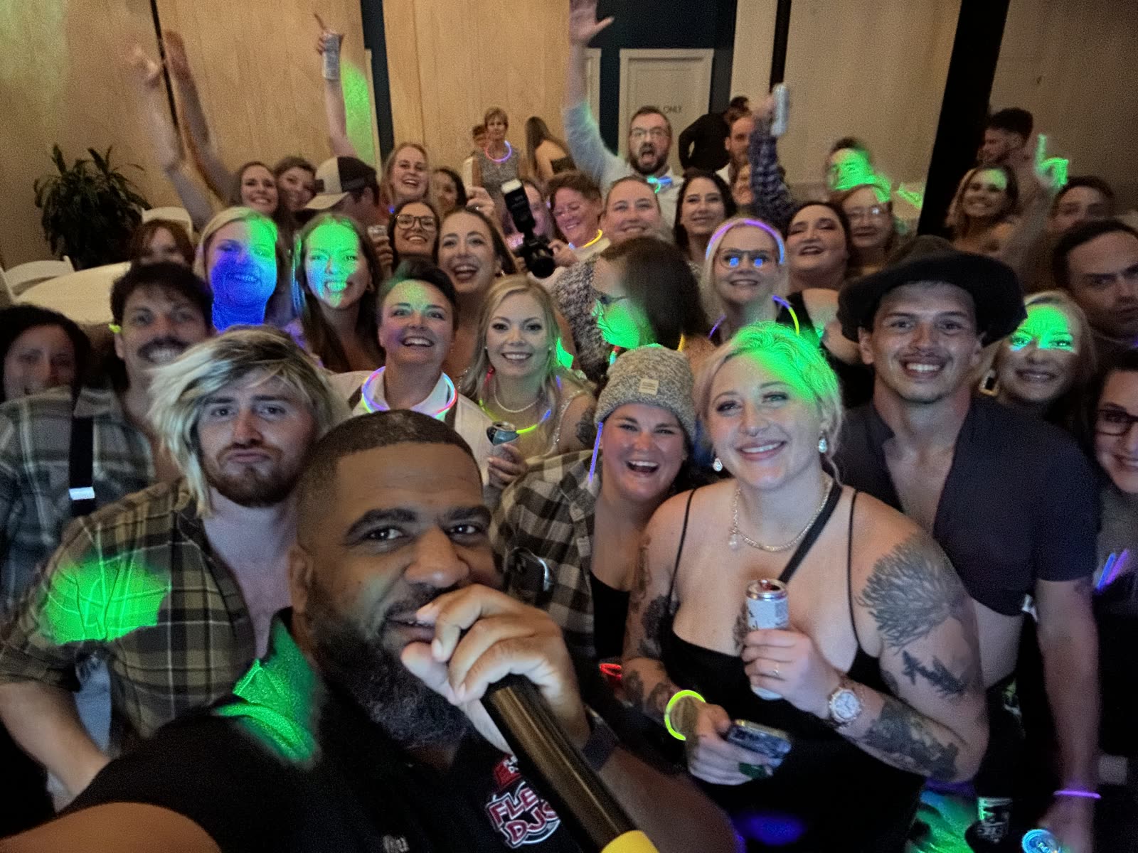 A packed dance floor crowded around the microphone.